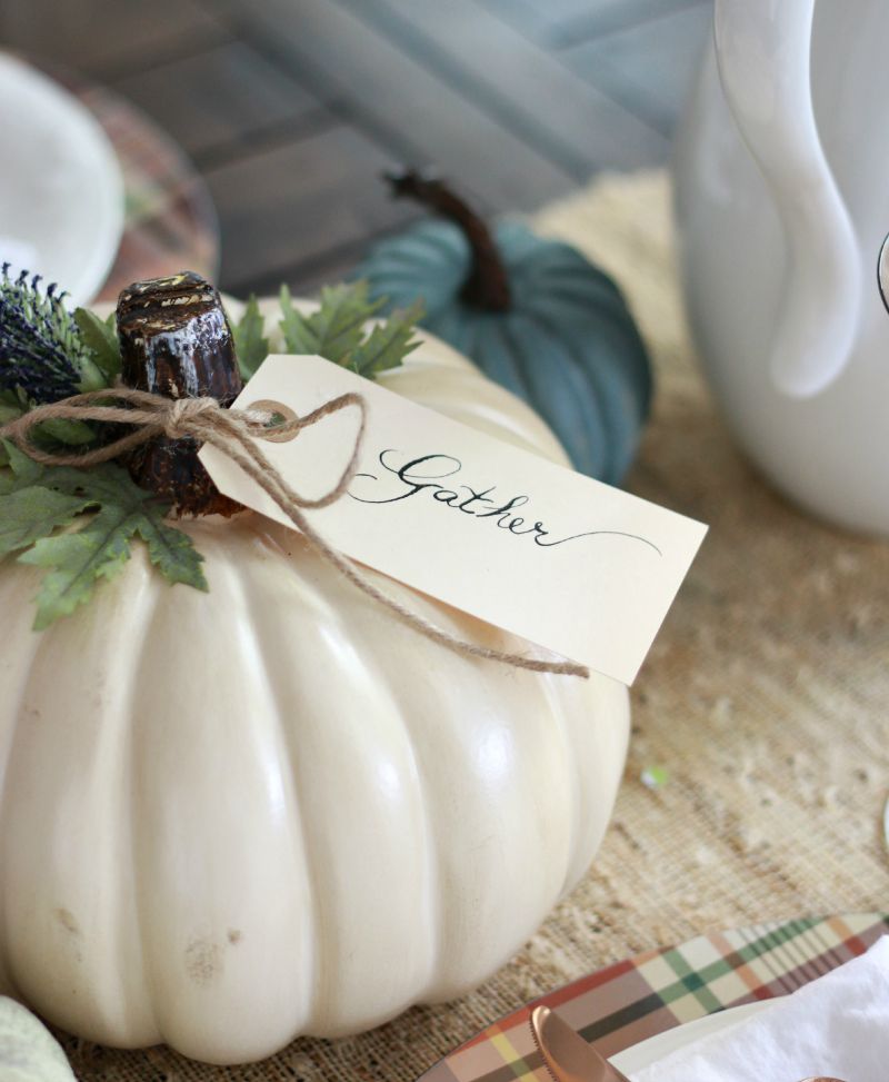 Add a thoughtful touch to your table with words of the season. Some ideas could be: gather, together, grateful, family. These sweet sentiments can be handwritten calligraphy, or you can print the words out and cut the paper into the shape of a tag if handwriting isn’t your specialty.