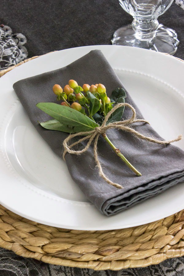 Place Setting Ideas: The dainty details can make the biggest impact. Small, colorful sprigs of berries or flowers are all it takes to make the napkin the highlight of the place setting. Go for a vintage, rustic look with twine or a more polished look with simple white ribbon.