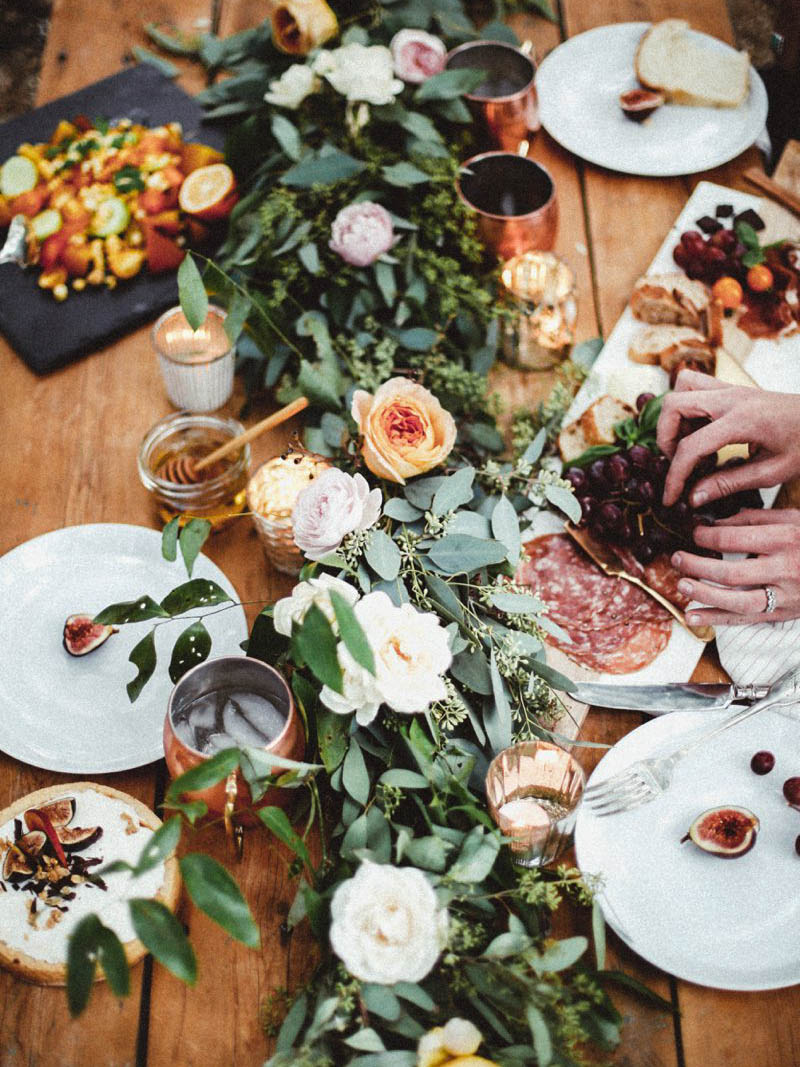 Thanksgiving Tablescape Ideas: Use greenery such as eucalyptus or myrtle along the center of your table use as many or as few mini pumpkins as you’d like. / theanastasiaco.com