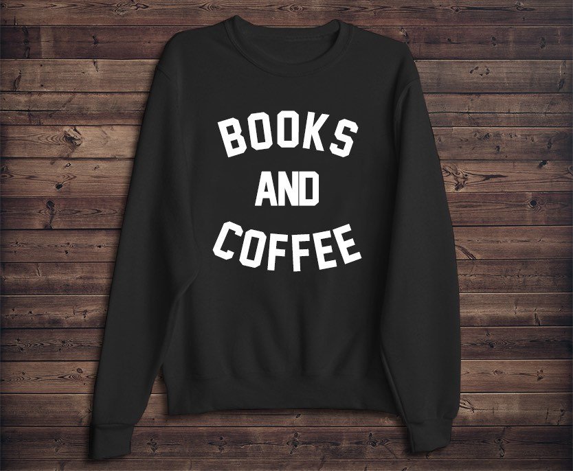 Coffee Lover Gift: Cozy sweatshirt. Curling up with a cup of coffee requires nothing but the coziest of clothes. A warm mug of coffee on a Saturday morning is the perfect start to any weekend and any coffee lover will appreciate a cozy, coffee-drinking sweatshirt. Featured: Emtizee