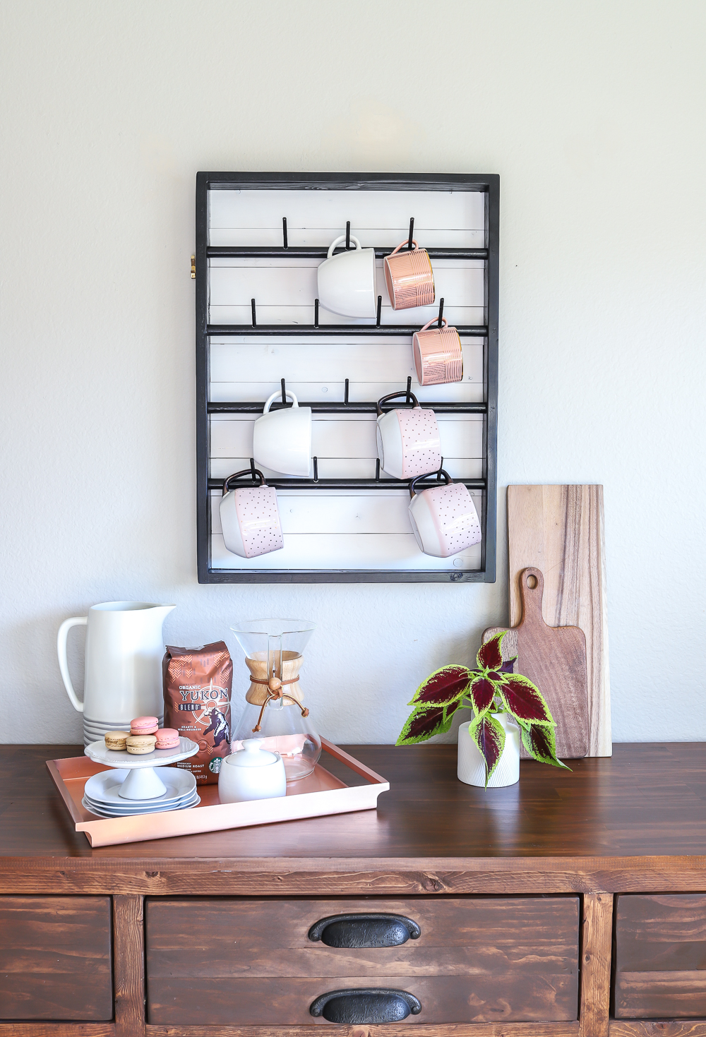 Kitchen Decorating Ideas: Instead of keeping your prized coffee mug collection hidden behind closed doors, put them out for the world to see! A coffee mug rack, like this one, helps to keep them tidy and within reach for your morning cup of joe.  