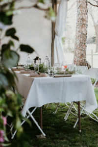 Walking into this event was like stepping foot in a secret garden. The dreamy details included an arch filled with flowers and greenery, a delicious catered meal, personalized wine bottle labels, fresh-cut bouquets, string lights, and thoughtful place settings. Creating a beautiful ambiance for your event is all in the details. Host a magical backyard rehearsal dinner party with these four simple tips! / theanastasiaco.com