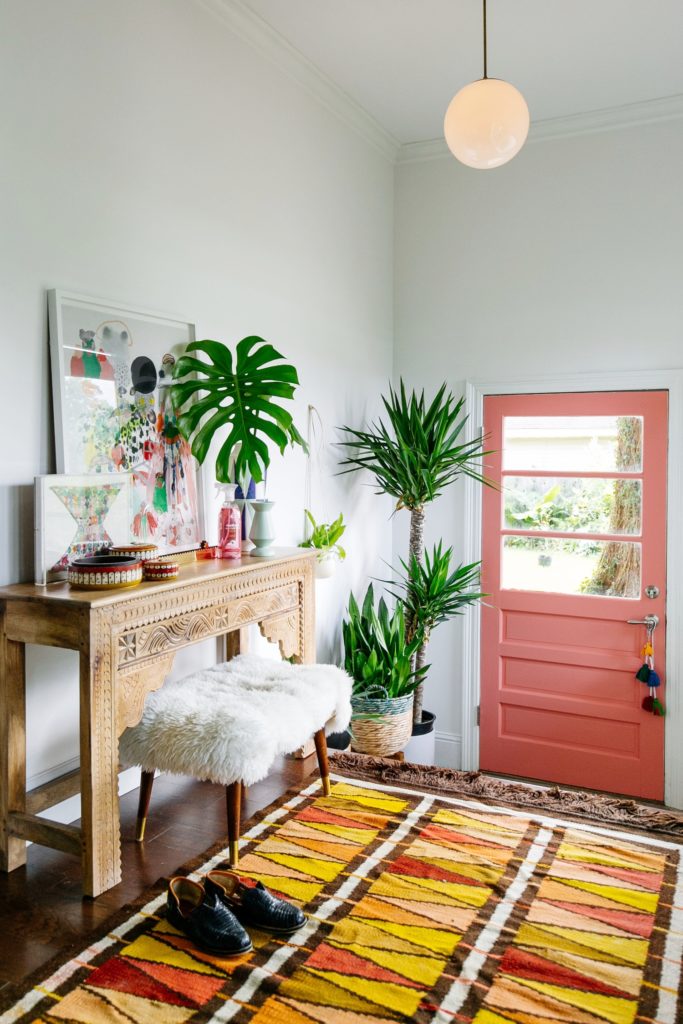 Coral Front Door / Another option for those who really want to go all-in, repainting your front door in ‘Living Coral’ will give new life to the front of your home. Complete this look with a cute wreath! / Living Coral was named as Pantone’s 2019 Color of the Year! Here are 8 ways to add a dose of this chic, cheerful hue into your life. / theanastasiaco.com