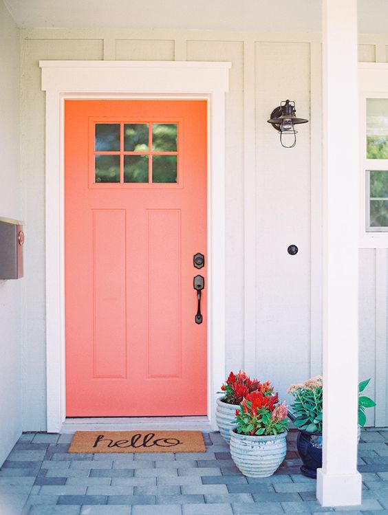 Coral Front Door / Another option for those who really want to go all-in, repainting your front door in ‘Living Coral’ will give new life to the front of your home. Complete this look with a cute wreath! / Living Coral was named as Pantone’s 2019 Color of the Year! Here are 8 ways to add a dose of this chic, cheerful hue into your life. / theanastasiaco.com